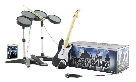 Rock Band game peripherals including electronic drums, guitar controller, foot pedal, and game case